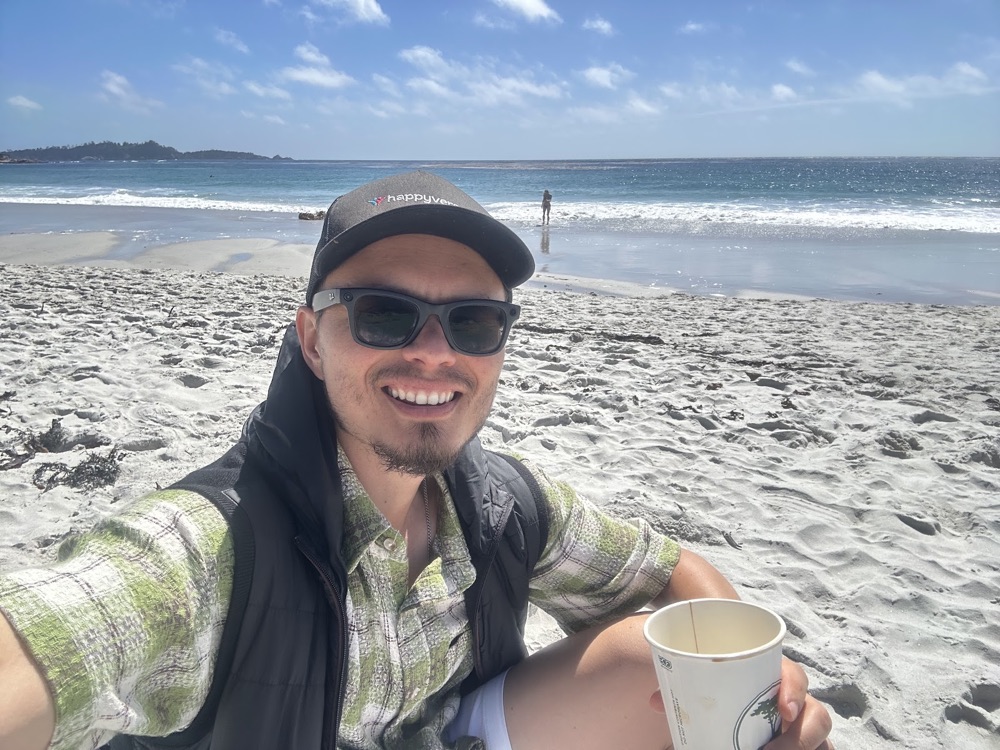 Max on the beach in Carmel with a coffee