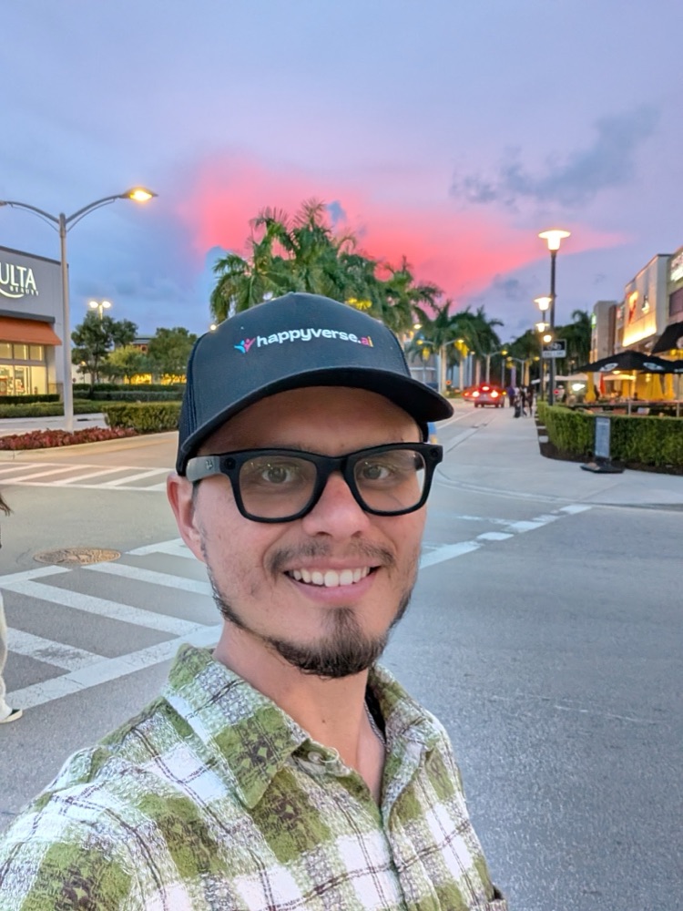 Max under a pink evening sky and palm trees