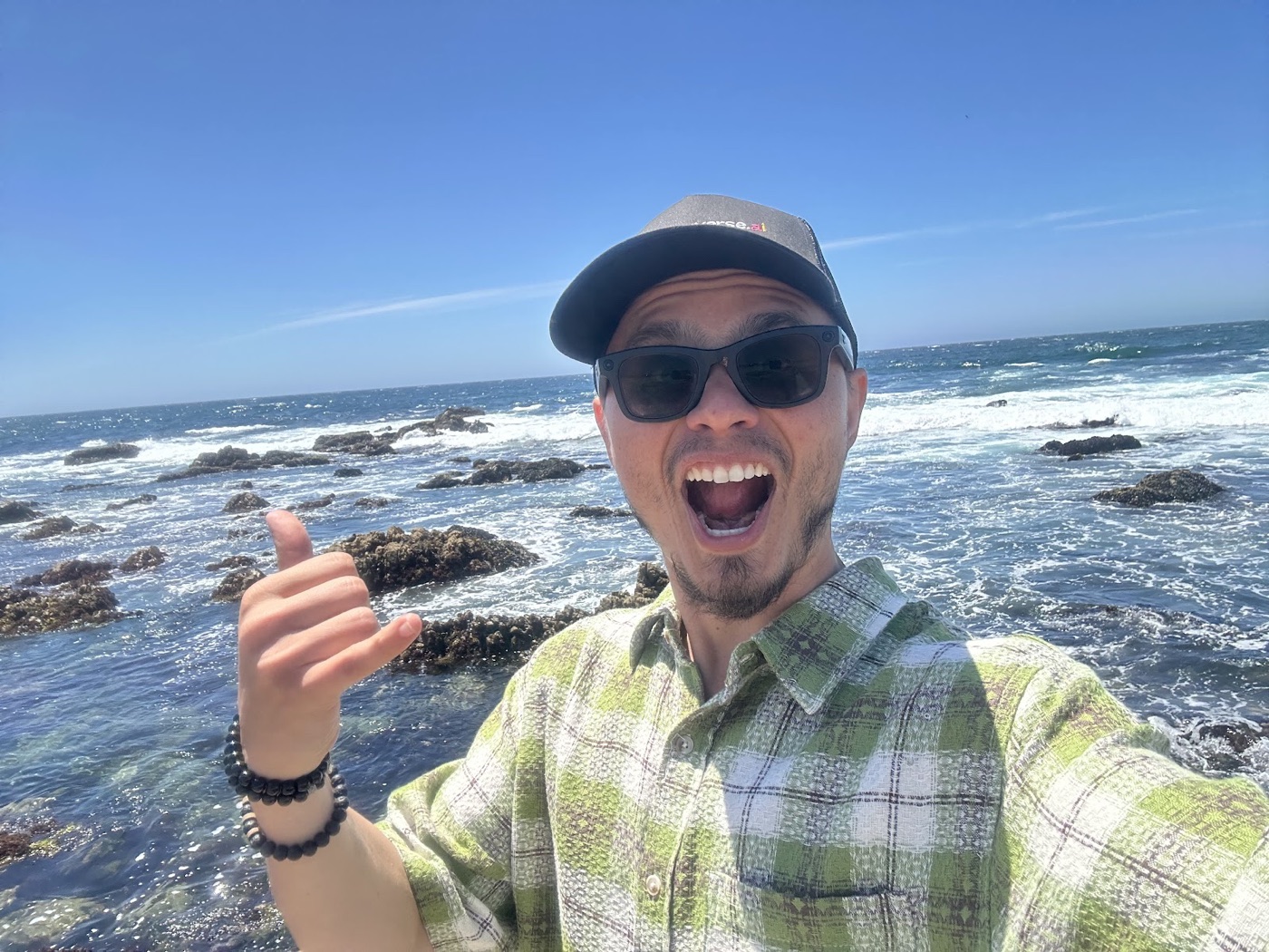 Max laughing on the rocky California coast