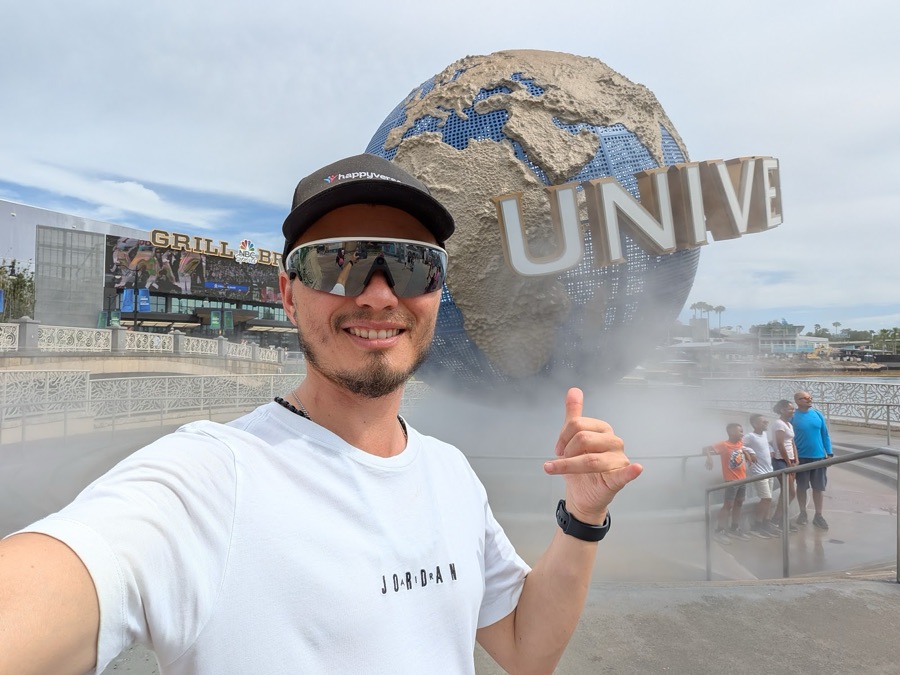 Max in front of the Universal globe